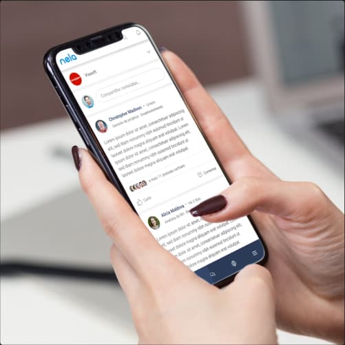 Person using a smartphone with the Viasoft Nela platform. The phone screen shows the Nela platform interface.