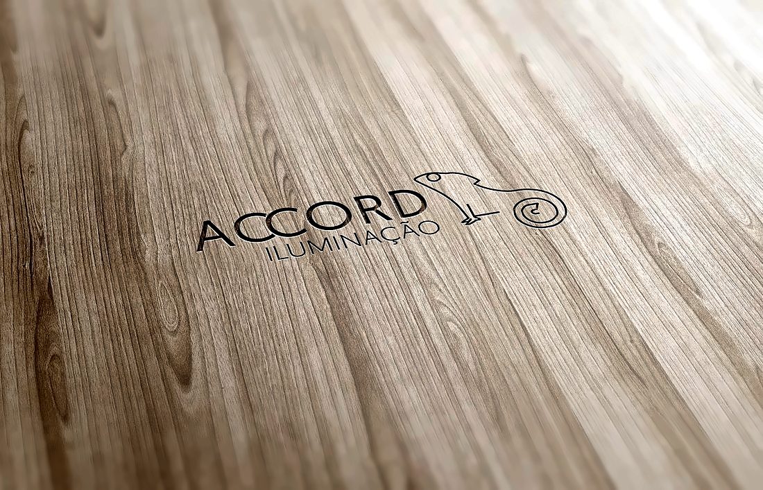 Marchio di Accord Iluminação inciso nel legno