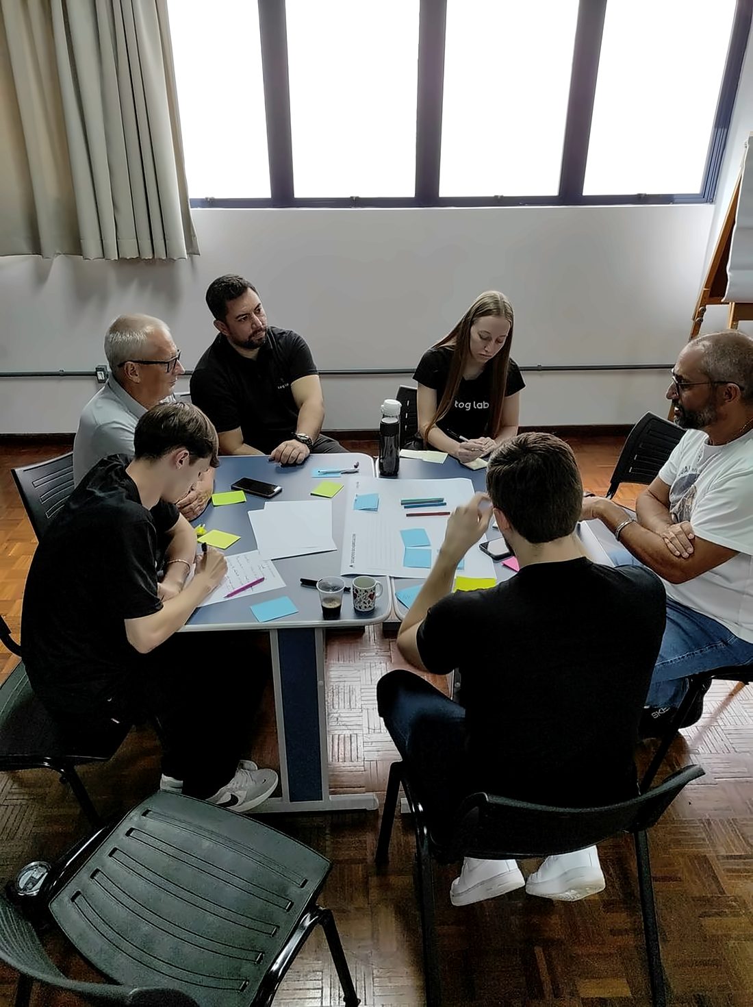Group discussing ideas at a table during the immersion